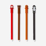 Set of four Flying Tiger Copenhagen erasable office pens with festive Christmas toppers, perfect for holiday writing and note-taking.