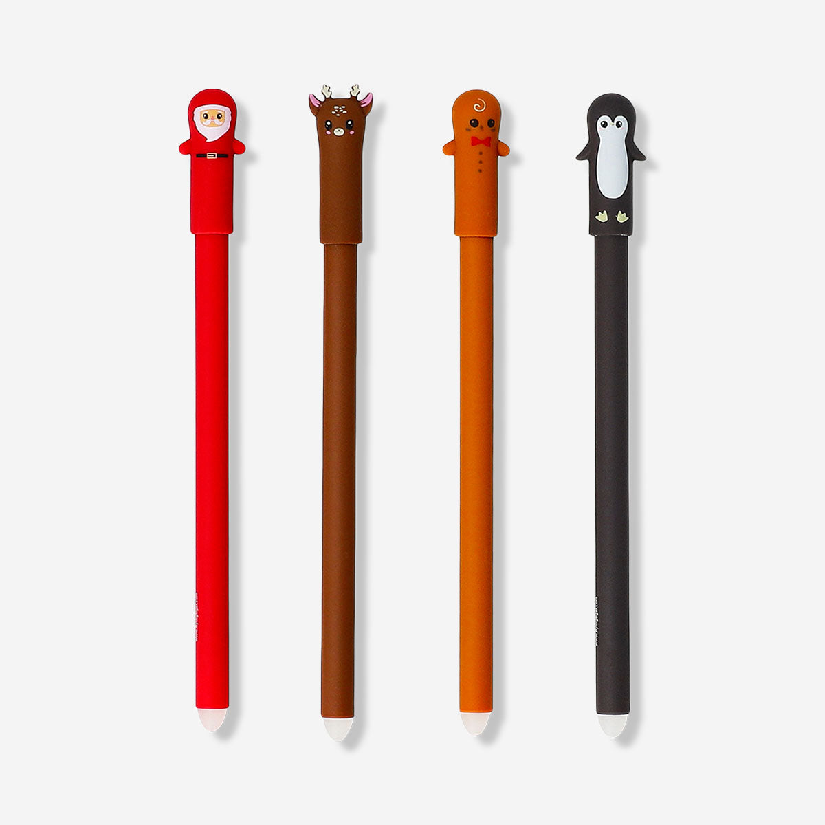 Set of four Flying Tiger Copenhagen erasable office pens with festive Christmas toppers, perfect for holiday writing and note-taking.