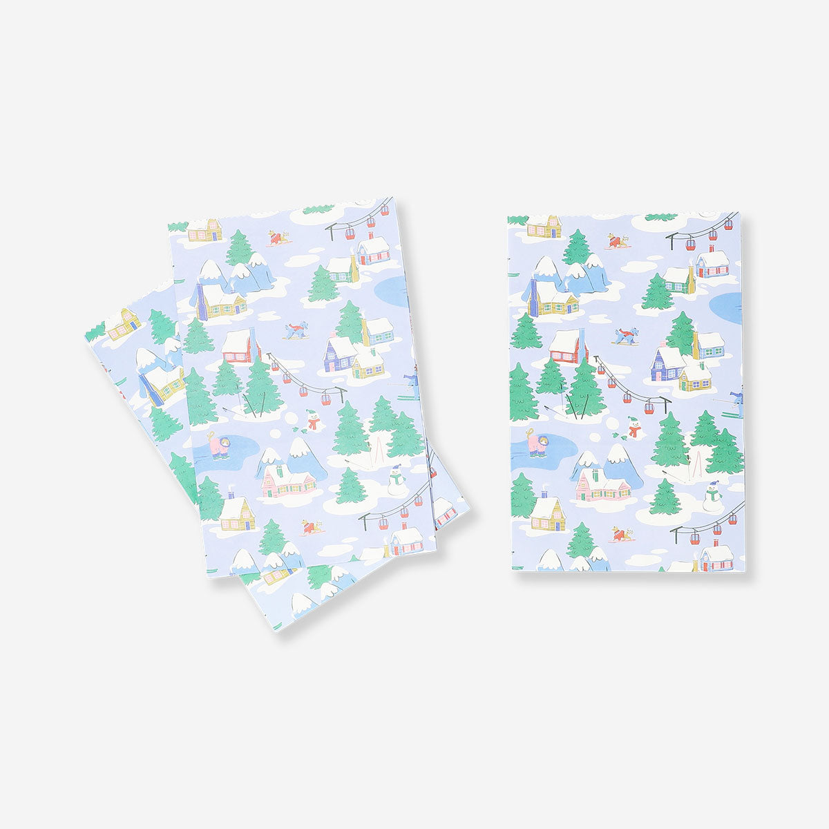 Three office gift bags with scenic lodge imagery from Flying Tiger Copenhagen, featuring cozy mountain and cabin scenes.