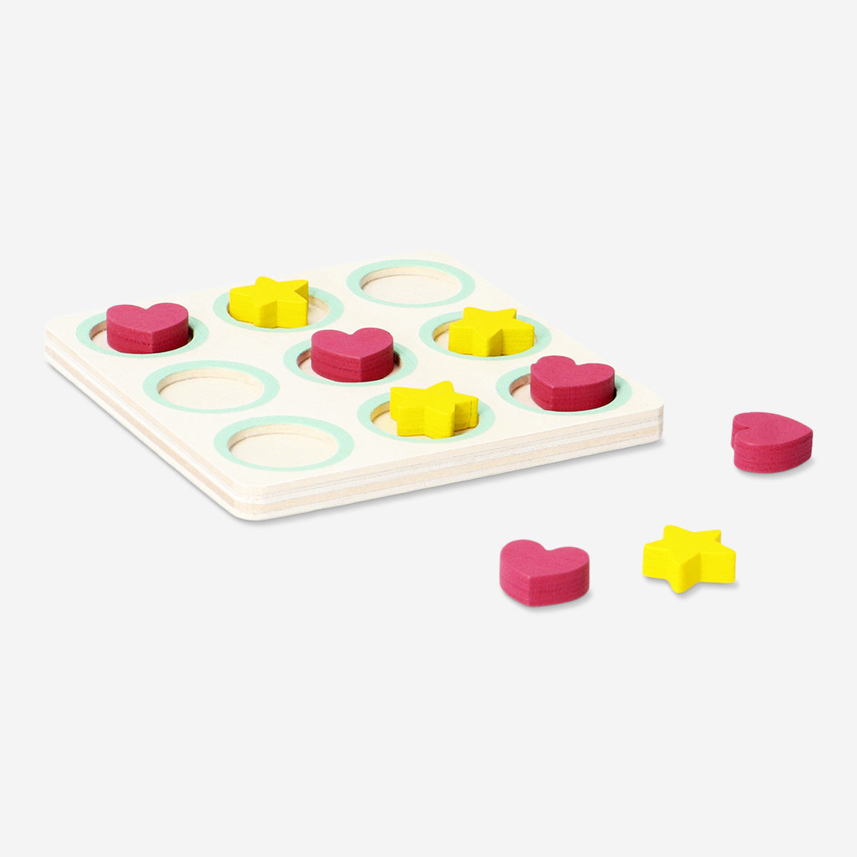 Flying Tiger Copenhagen Tic Tac Toe game with a wooden grid and black and white game pieces on a table.
