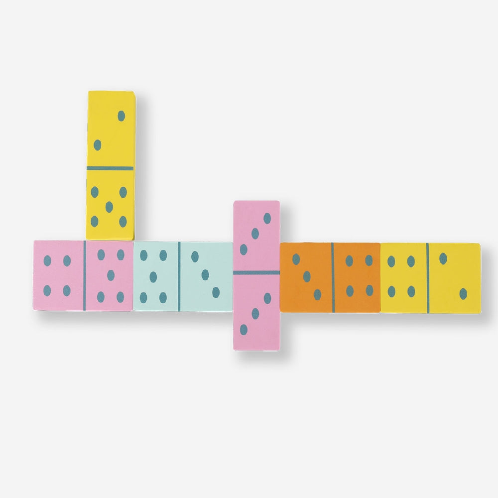 Oversized domino game by Flying Tiger Copenhagen with colorful, large plastic tiles arranged on a grassy lawn for outdoor fun.