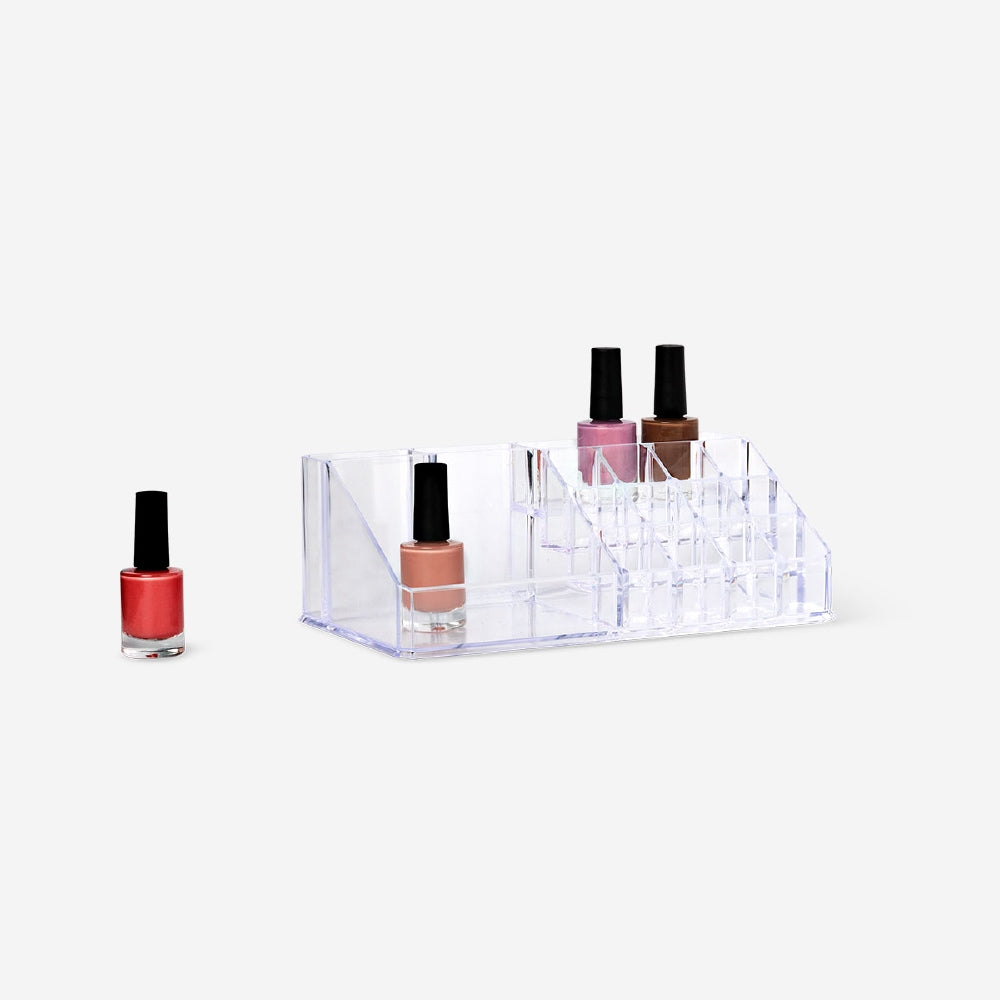 Clear nail polish organiser from Flying Tiger Copenhagen with compartments for easy storage, measuring 12.5x22 cm.