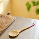 Flying Tiger Copenhagen designer wood tasting spoon, 30 cm long, with a smooth handle and natural wood finish for kitchen use.