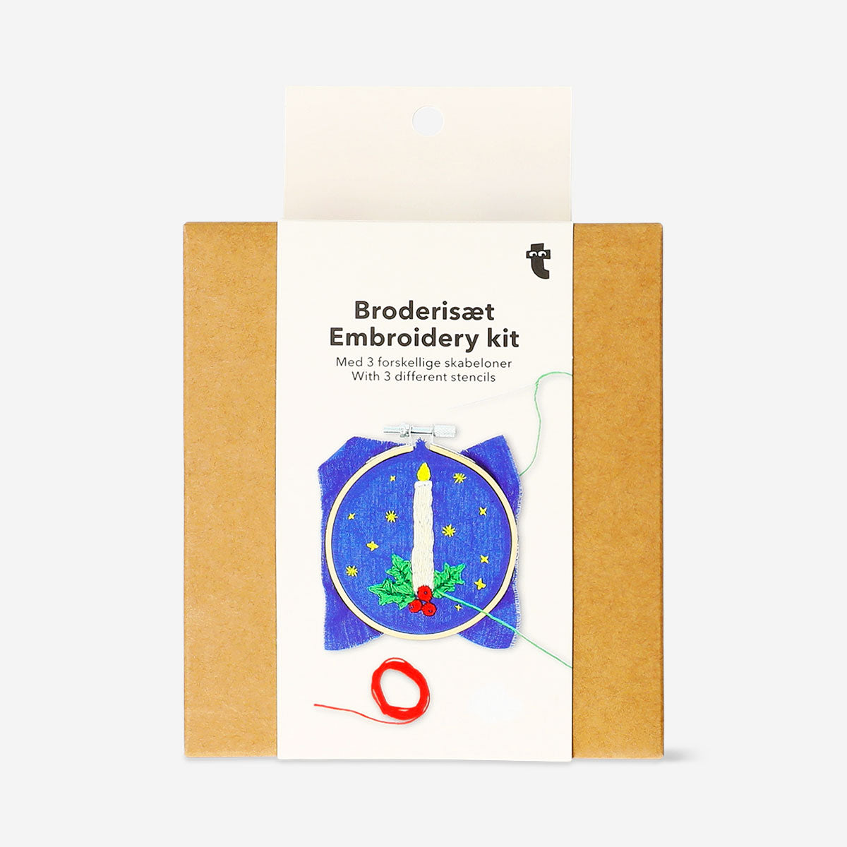 Christmas-themed embroidery kit from Flying Tiger Copenhagen featuring colorful threads, fabric, and embroidery accessories for holiday crafts.