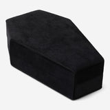 Black coffin-shaped jewellery storage container from Flying Tiger Copenhagen, designed for organizing personal care accessories.