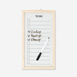 Wood-framed Flying Tiger Copenhagen office planner board with marker for organizing and note-taking.