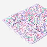 Floral bed pocket from Flying Tiger Copenhagen, 44x39 cm, shown hanging on a bed frame with colorful floral design.