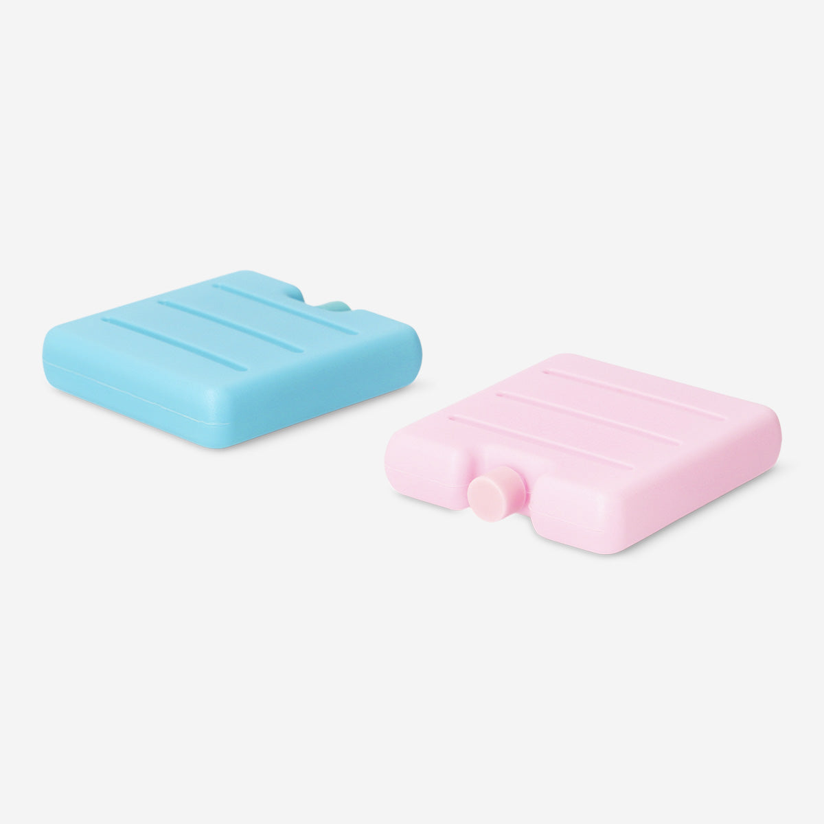 Two colorful blue and pink ice blocks for home use, featuring vibrant designs from Flying Tiger Copenhagen.