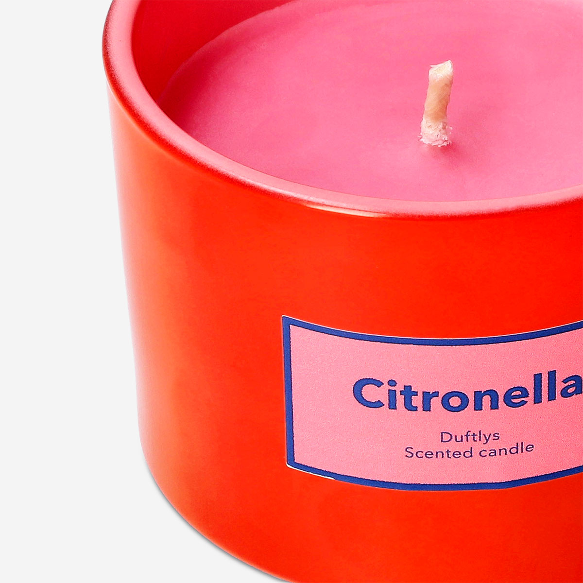 Flying Tiger Copenhagen scented outdoor candle with citronella fragrance in a glass holder for garden and patio use.