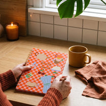 Flying Tiger Copenhagen office recipe book with colorful pages and creative cooking ideas for workspace meals.