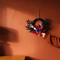 Decorative Halloween wreath, 20 cm diameter, with spooky accents and orange and black colors, by Flying Tiger Copenhagen for home decor.