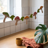 Felt mushroom garland, 200 cm party decoration with colorful mushroom shapes, ideal for festive events and celebrations.