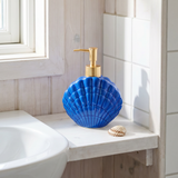 Blue ceramic seashell soap dispenser for home use, featuring a detailed seashell design and a pump top from Flying Tiger Copenhagen.