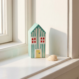 Decorative yellow house figurine for home decor, 13 cm, by Flying Tiger Copenhagen, with a charming, vibrant design.