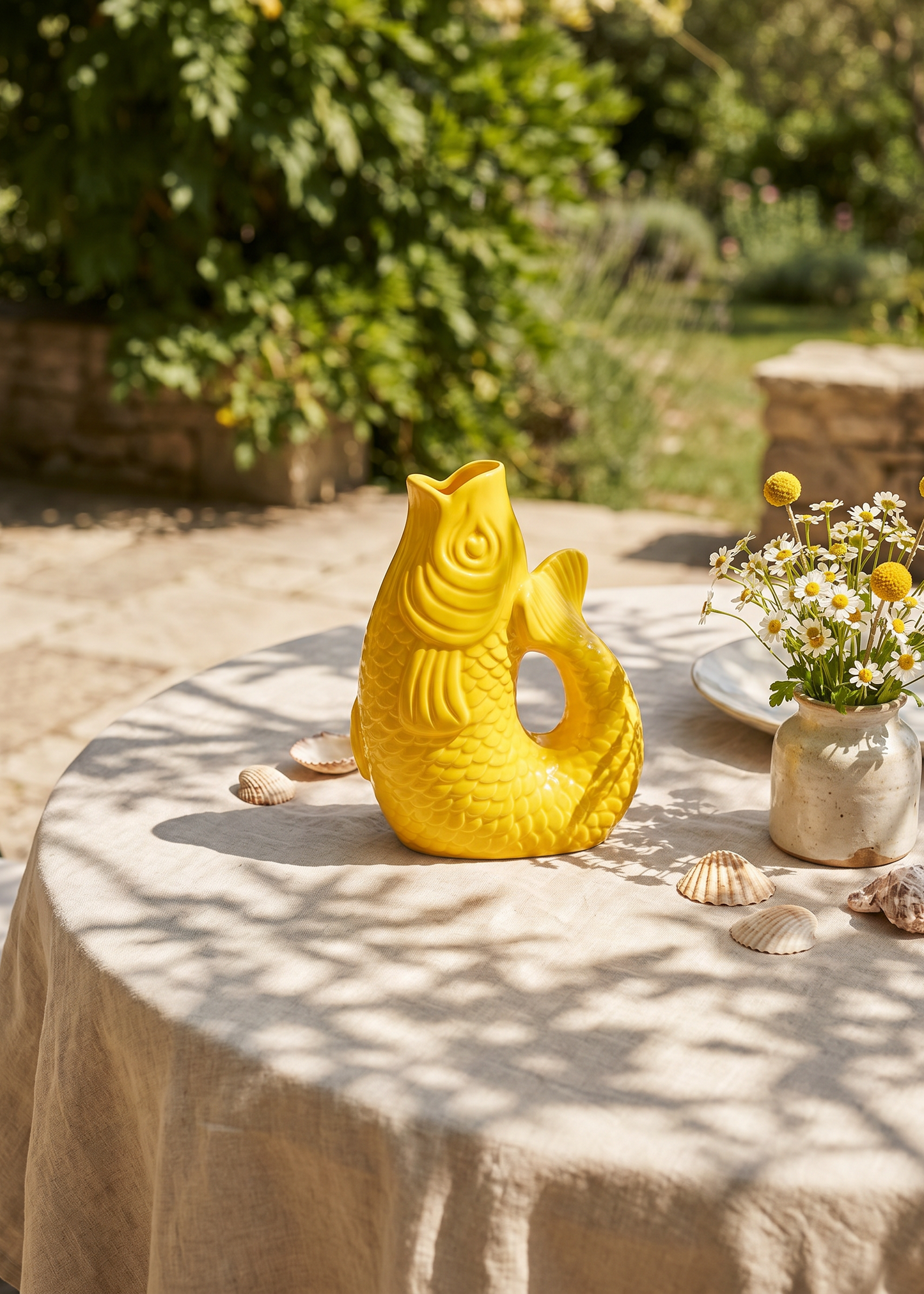 Yellow fish-shaped vase, 21 cm tall, made of ceramic, designed for home decor by Flying Tiger Copenhagen.