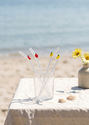 Set of four glass straws with colorful fruit decorations from Flying Tiger Copenhagen for stylish kitchen use.
