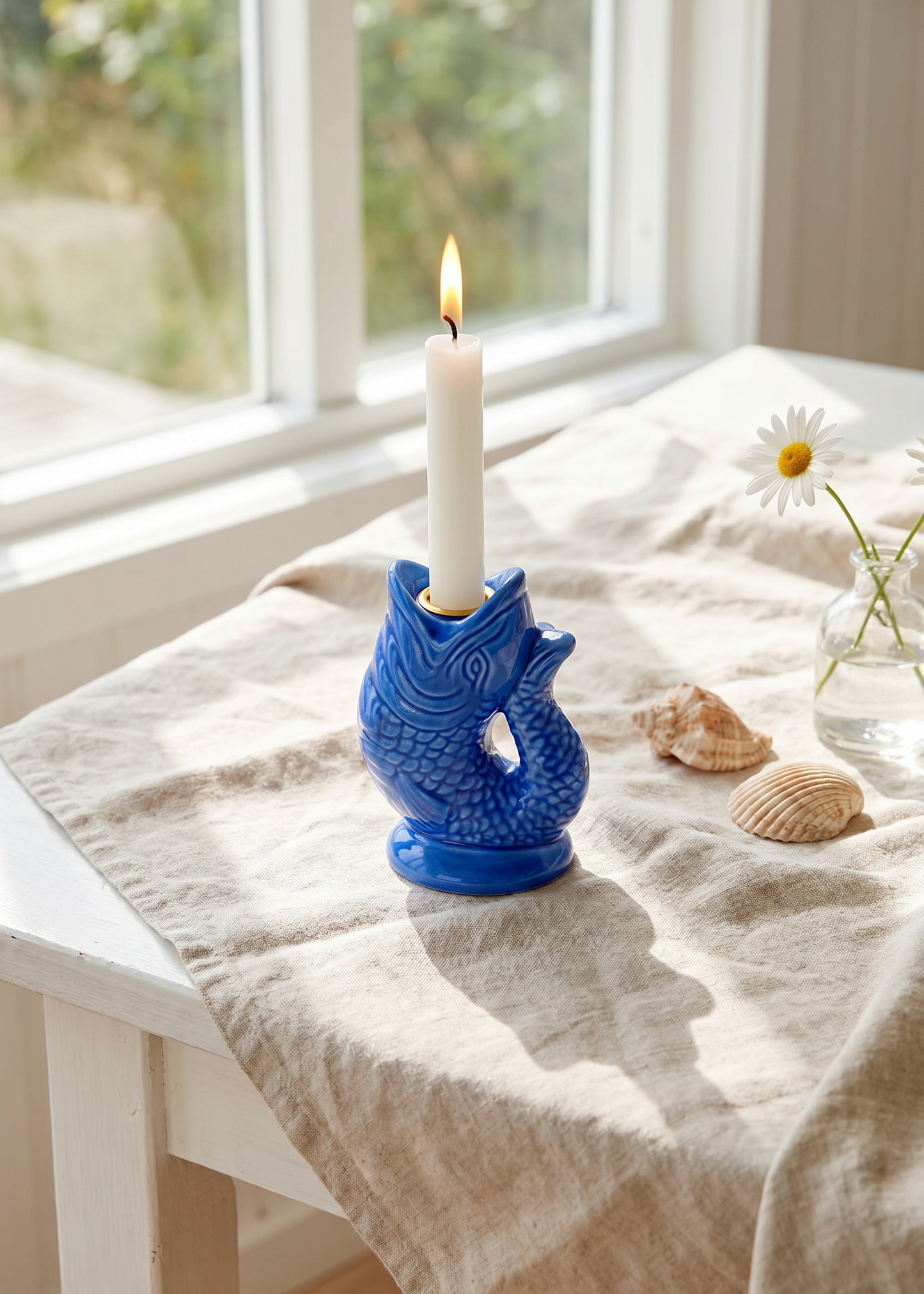 Fish-shaped candle holder from Flying Tiger Copenhagen, 12 cm tall, designed for home decor with a sleek, modern look.
