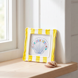 Yellow ceramic striped picture frame measuring 10x10 cm, perfect for home decor by Flying Tiger Copenhagen.