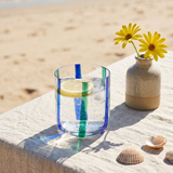 Glass with blue and green stripes, 300 ml, kitchen drinking glass by Flying Tiger Copenhagen, clear glass with colorful stripe design.