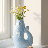 Light blue fish-shaped ceramic vase, 21 cm tall, designed for home decor by Flying Tiger Copenhagen.