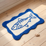 Flying Tiger Copenhagen fish motif bath mat, 40x60 cm with colorful fish design, soft fabric for bathroom decor and comfort.