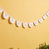 Colorful floral fabric garland from Flying Tiger Copenhagen, 300 cm long, perfect for party decoration on fun-themed backgrounds.