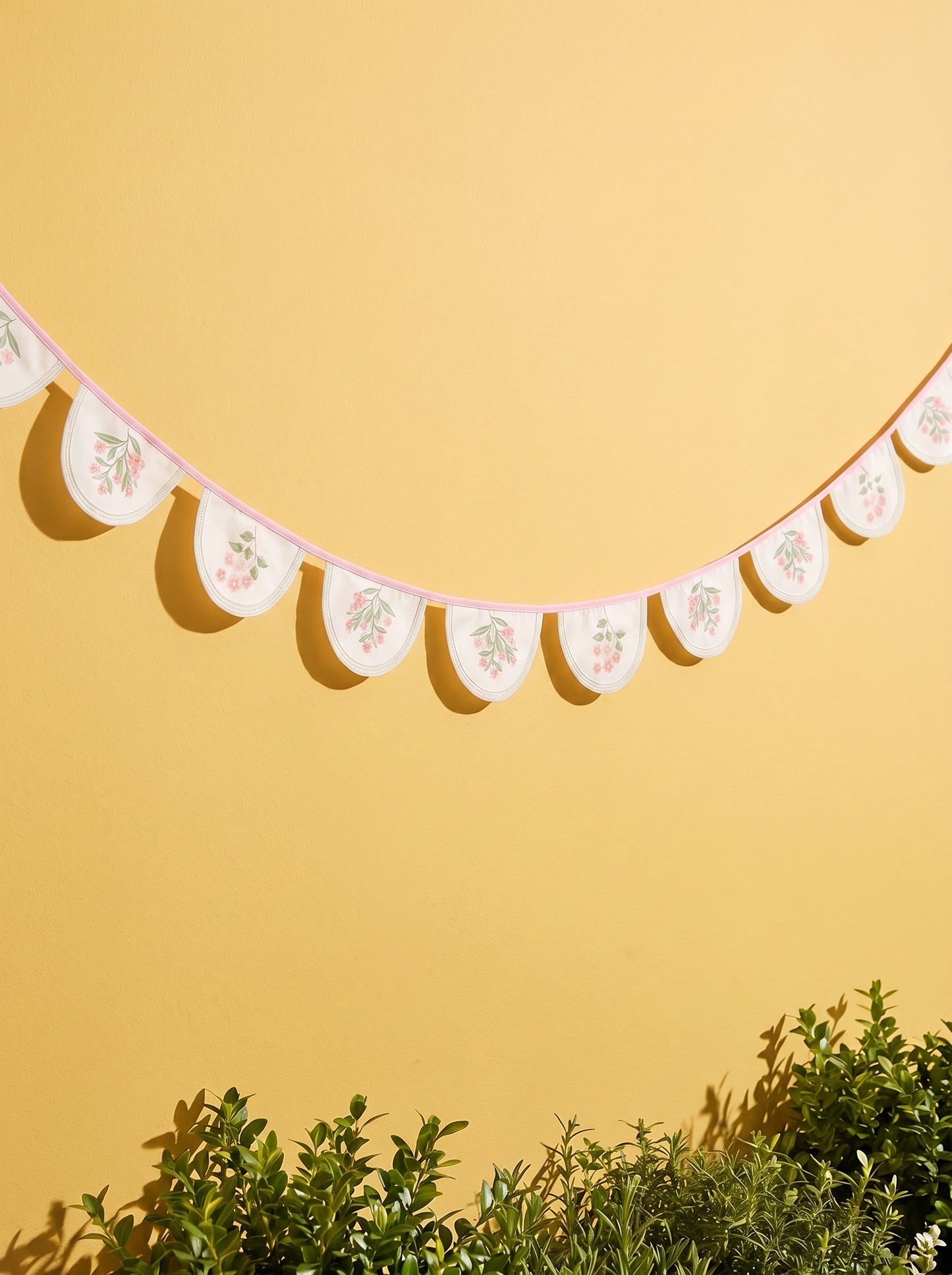 Colorful floral fabric garland from Flying Tiger Copenhagen, 300 cm long, perfect for party decoration on fun-themed backgrounds.