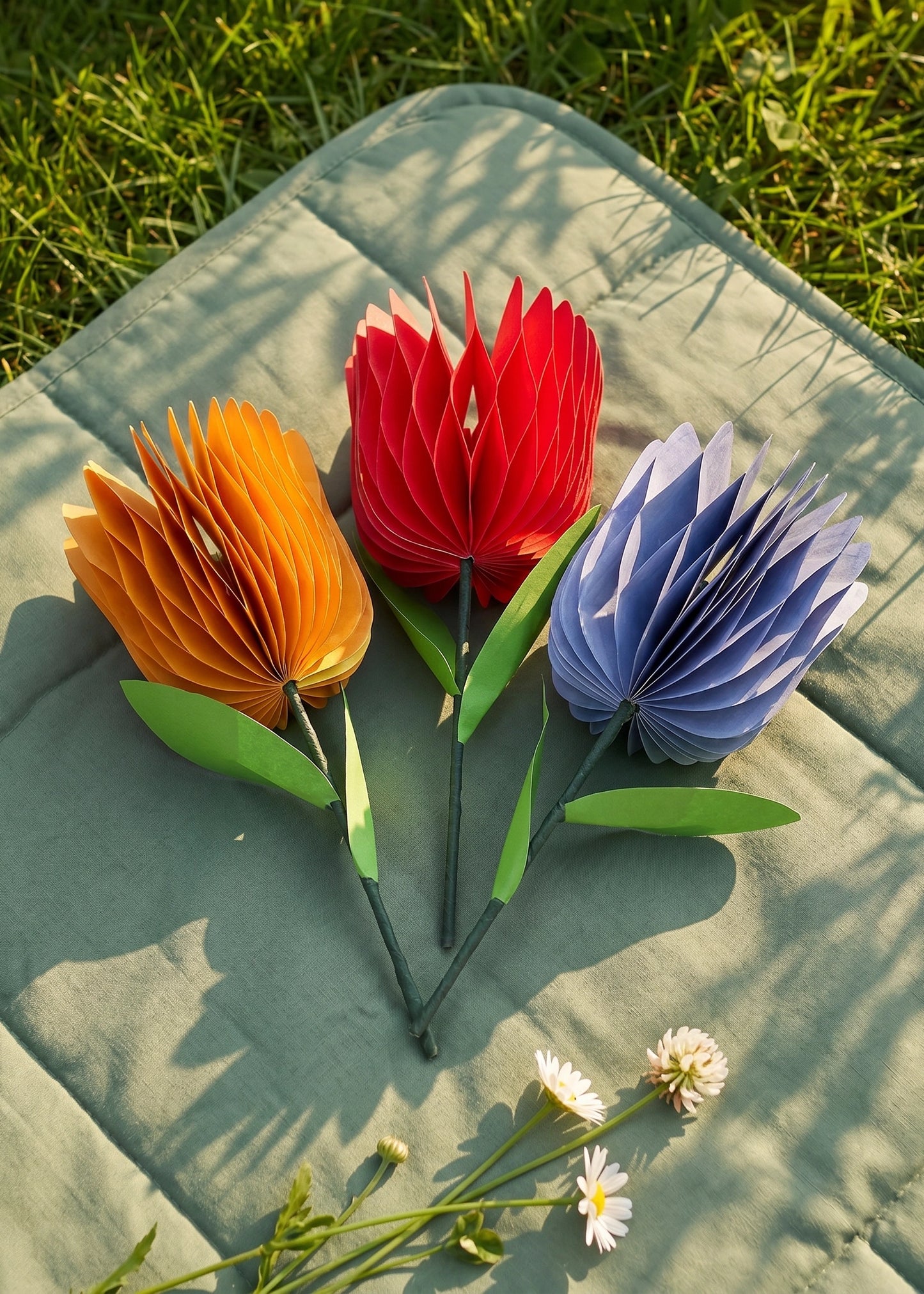 Set of three honeycomb paper flower decorations for parties, featuring colorful, textured paper blooms by Flying Tiger Copenhagen.