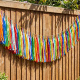Colorful party garland with paper tassels, 300 cm long, ideal for summer garden celebrations by Flying Tiger Copenhagen.