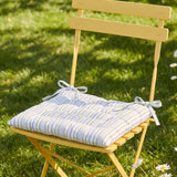 Yellow striped quilted seat pad from Flying Tiger Copenhagen, 40x40 cm, designed for comfortable chair cushioning.