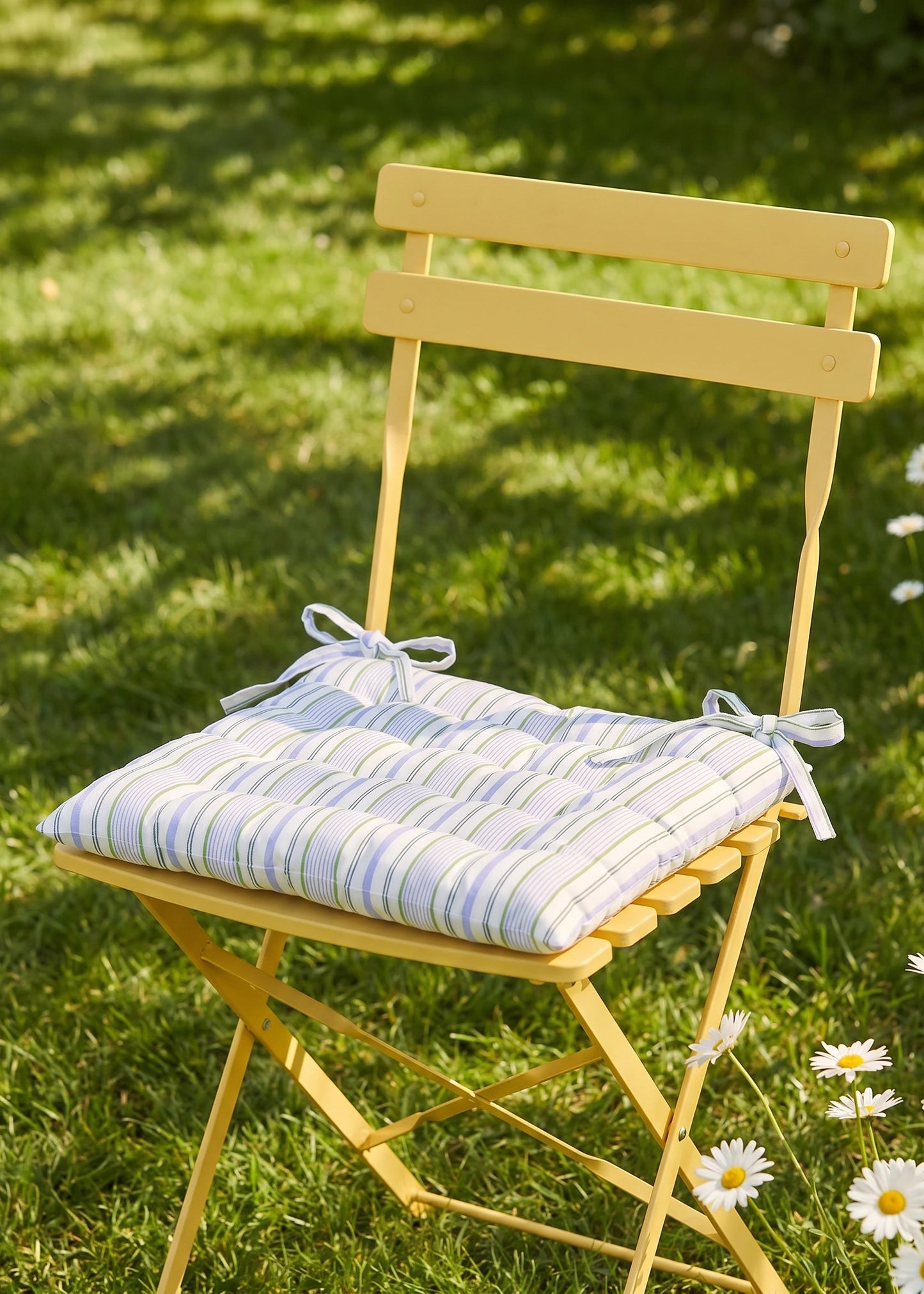 Yellow striped quilted seat pad from Flying Tiger Copenhagen, 40x40 cm, designed for comfortable chair cushioning.