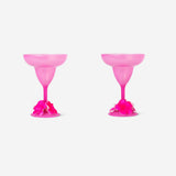 Two pink margarita glasses with flower decorations for party use, featuring the Flying Tiger Copenhagen brand design.