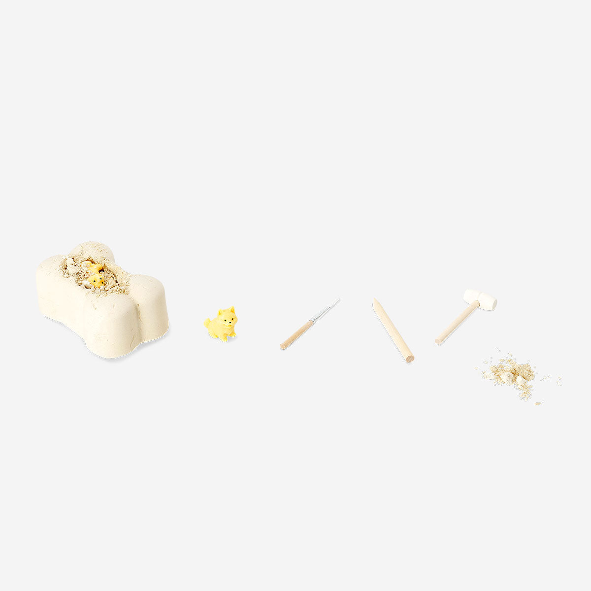 Toy excavation kit featuring bones from Flying Tiger Copenhagen, includes tools and plastic bones for kids' educational play.