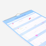 Blue Flying Tiger Copenhagen family planner for hanging, 2027, showing a weekly layout on a wall-mounted office organizer.