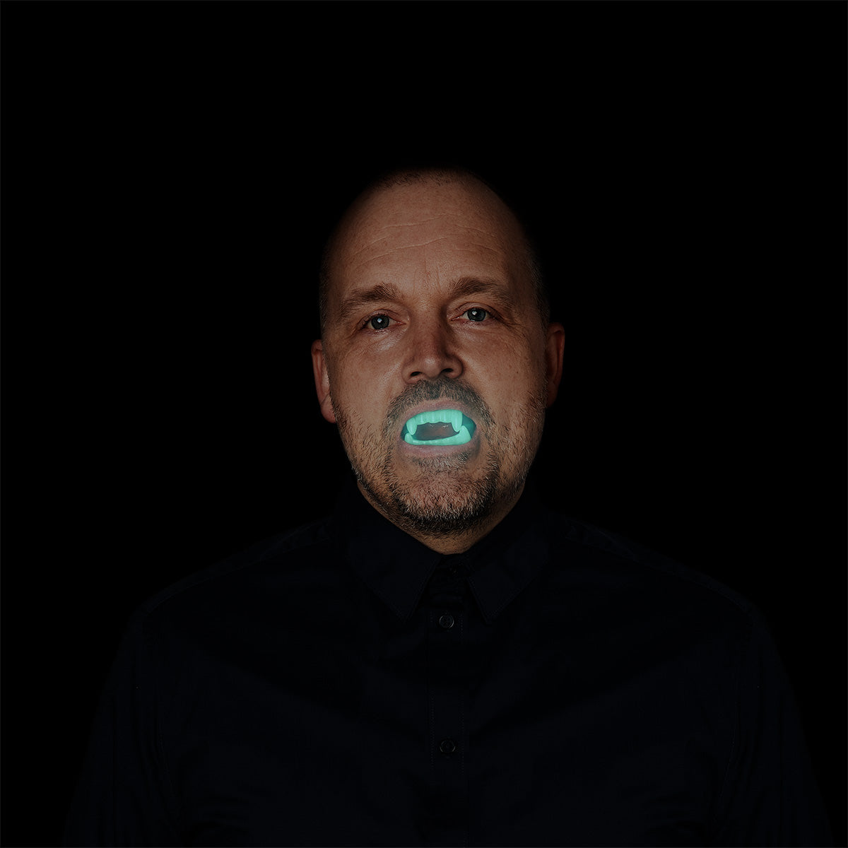 Glow in the dark vampire fangs from Flying Tiger Copenhagen, one size, featuring realistic-looking plastic vampire teeth for costume use.