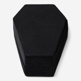 Black coffin-shaped jewelry storage container from Flying Tiger Copenhagen, designed for personal care and organization.