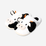 Textile cow slippers in size 37/38 with playful cow face design, from Flying Tiger Copenhagen.