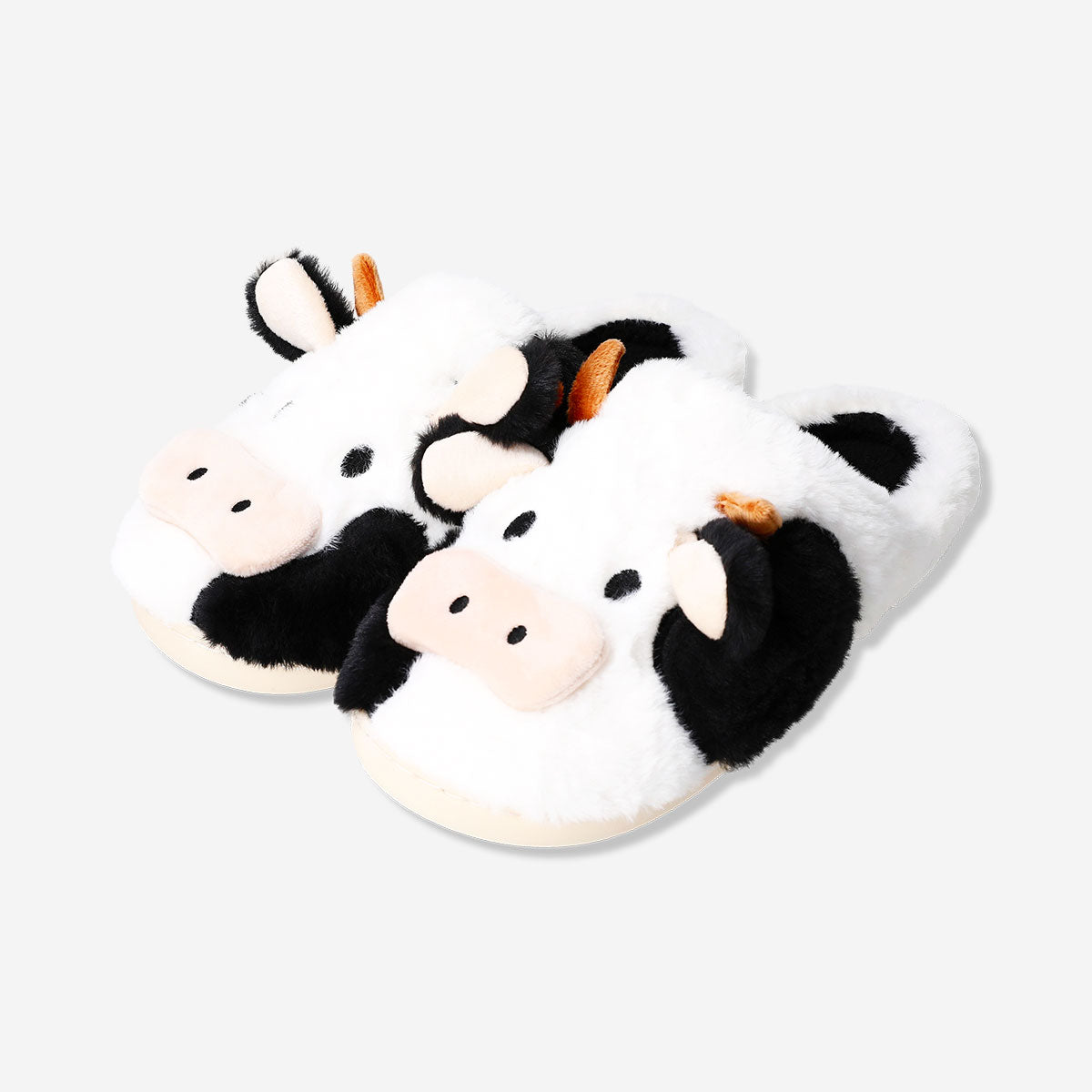 Textile cow slippers in size 37/38 with playful cow face design, from Flying Tiger Copenhagen.