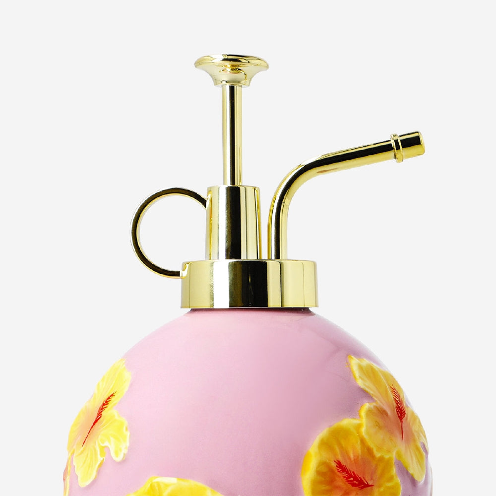 Ceramic mist spray bottle with hibiscus flower print, designed for home use, by Flying Tiger Copenhagen.