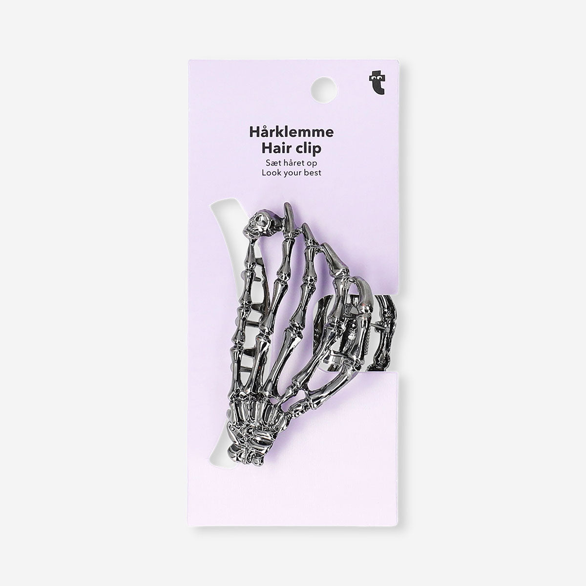 Skeleton hair clip made of textile from Flying Tiger Copenhagen, featuring a detailed skeleton design for stylish hair accessories.