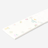 Flying Tiger Copenhagen shopping list notepad for office use, featuring a colorful, compact design with handwritten notes on paper.