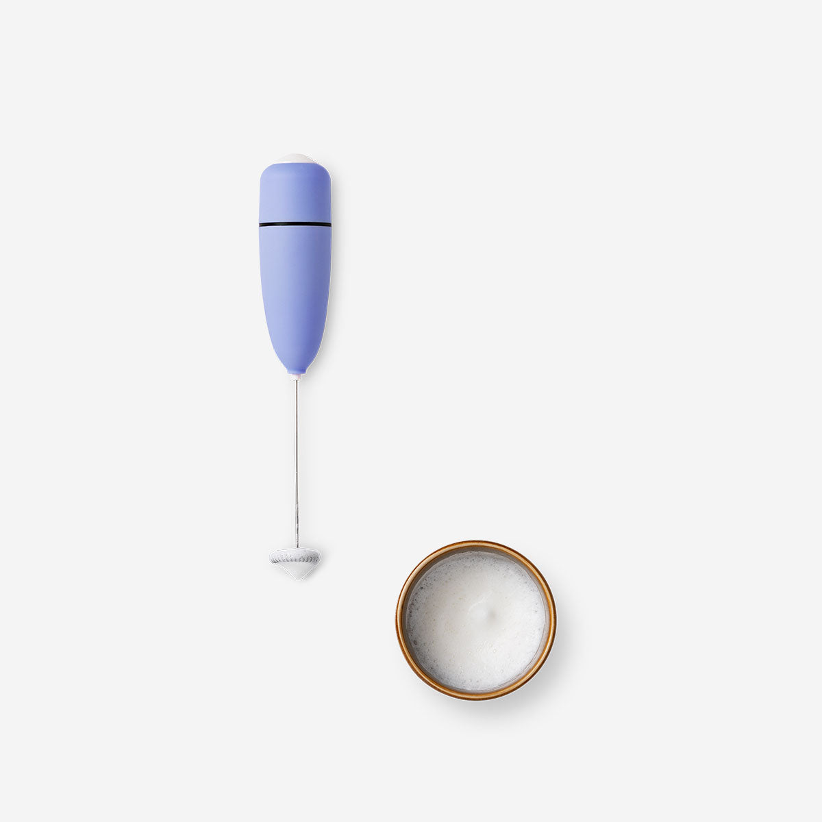 Purple milk foamer kitchen appliance from Flying Tiger Copenhagen with a sleek, compact design for frothing milk.