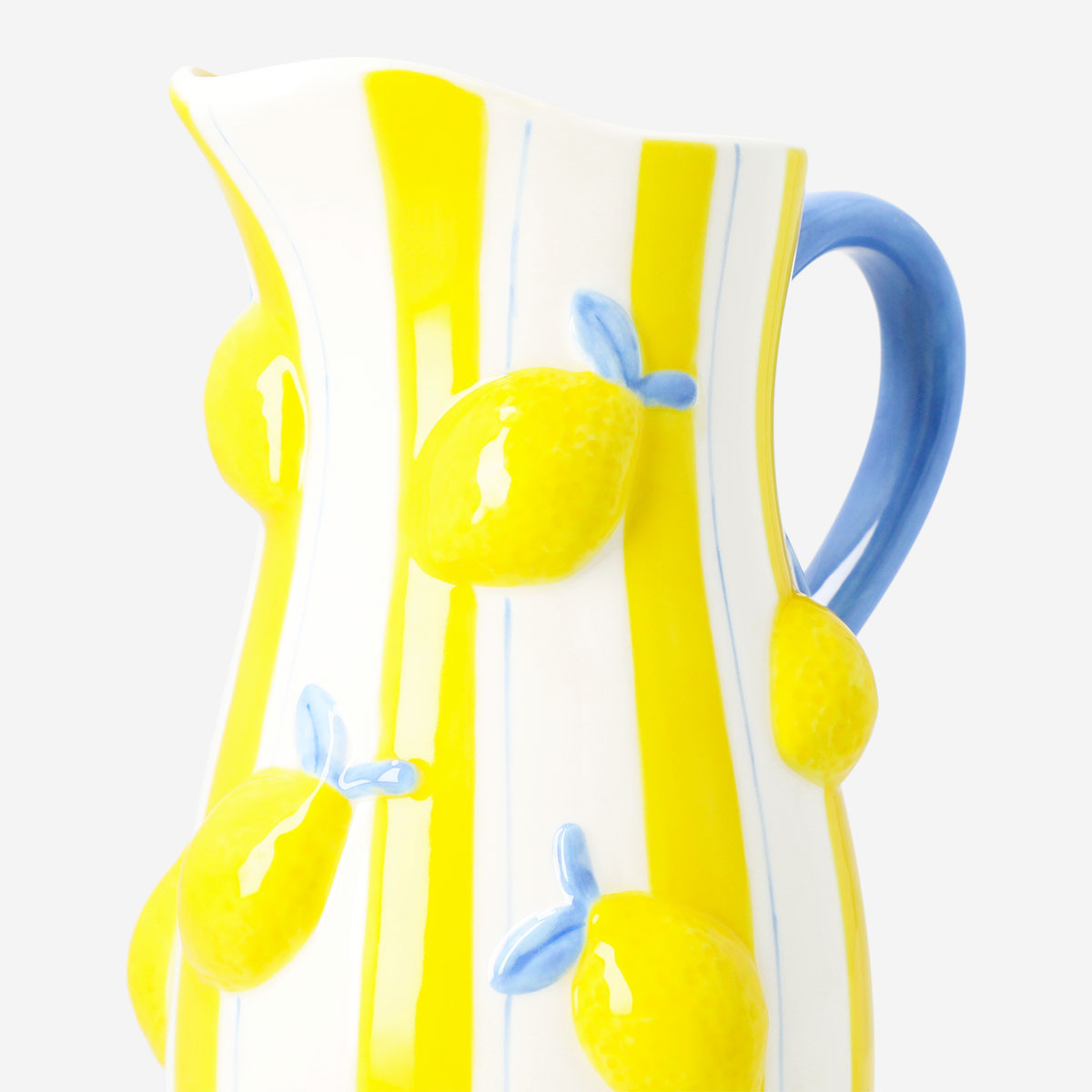 Ceramic kitchen jug with embossed lemon design, 1.2L capacity, by Flying Tiger Copenhagen, featuring a textured lemon pattern on the surface.