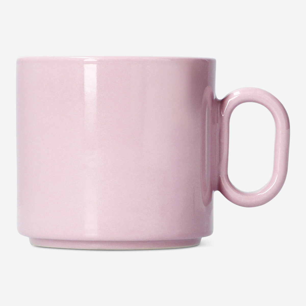 Pink ceramic mug with oval handle from Flying Tiger Copenhagen, 313 ml capacity, part of the Designer Collection, on a kitchen countertop.