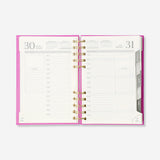 Pink B6 daily diary 2027 by Flying Tiger Copenhagen, featuring a compact office planner with date pages and a colorful cover.