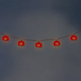 Flying Tiger Copenhagen Halloween pumpkin string lights hanging with orange pumpkin-shaped bulbs for festive home decor.