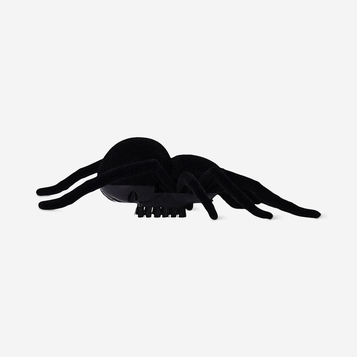 Black vibrating spider toy from Flying Tiger Copenhagen showing the textured body and multiple legs.