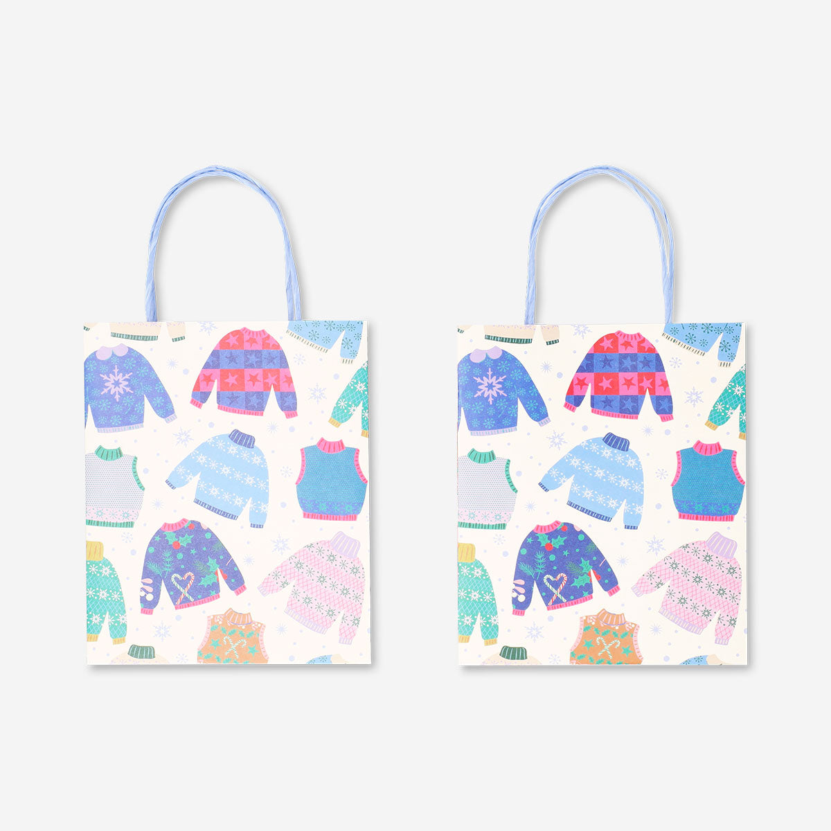 Two Flying Tiger Copenhagen gift bags with snowflake designs, perfect for holiday office presentations or gift wrapping.