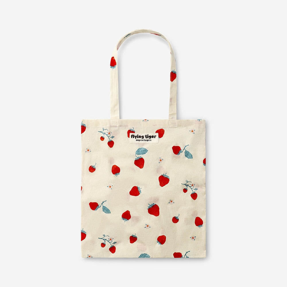 Flying Tiger Copenhagen strawberry print tote bag made of textile with colorful strawberry pattern and sturdy handles.