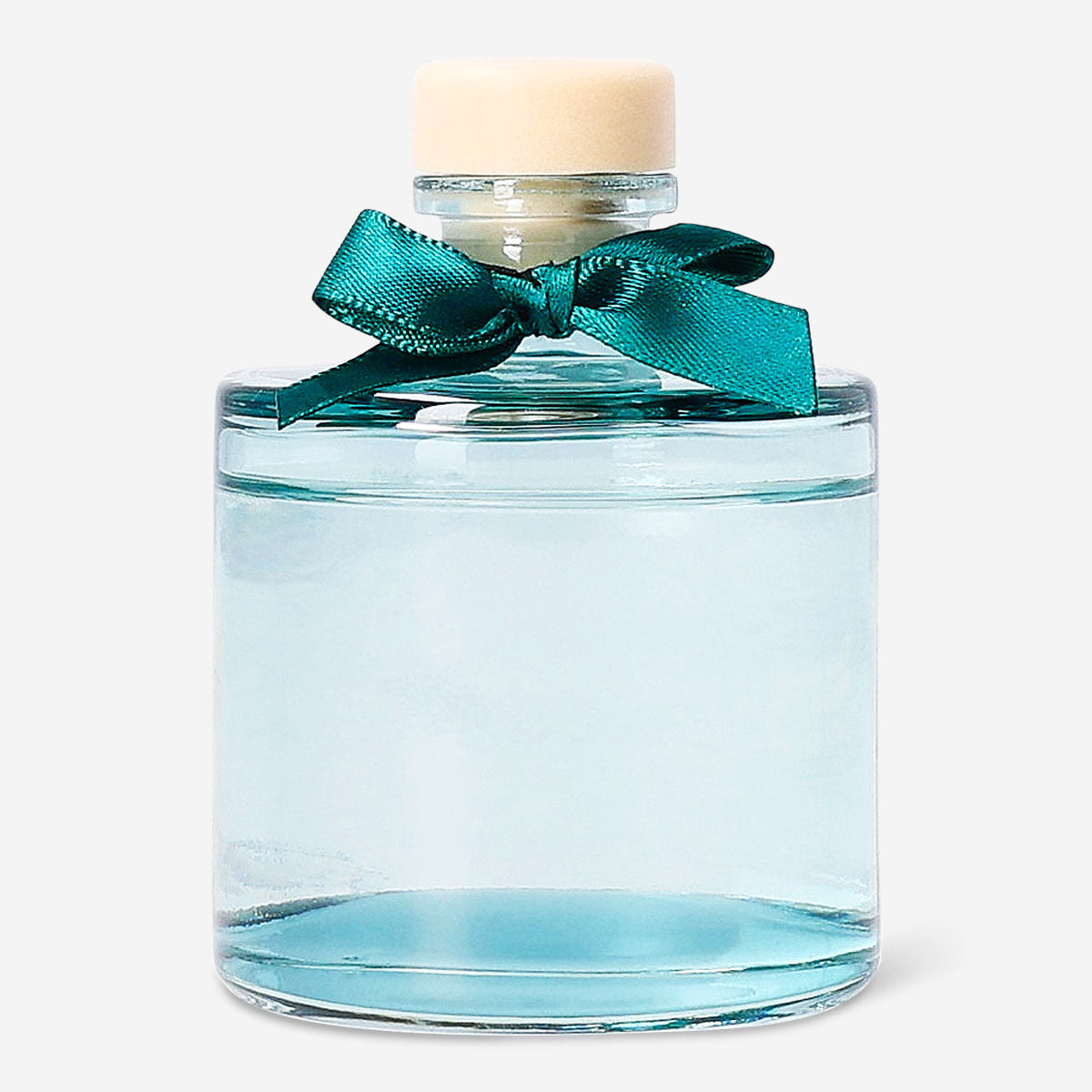 Flying Tiger Copenhagen evergreen reed diffuser for home, featuring a glass bottle with natural reeds and lush green foliage.